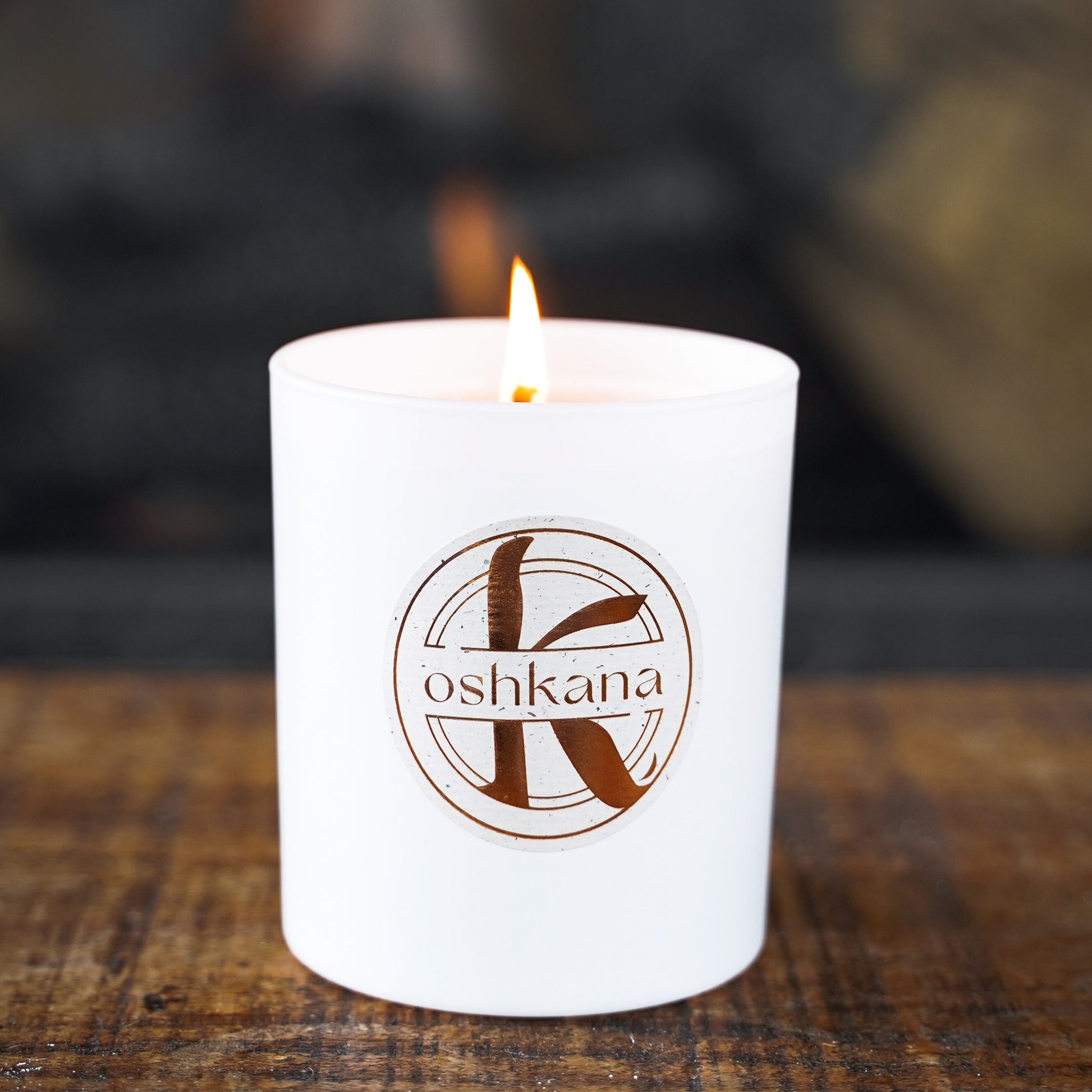 oshkana fireside candle on plain dark background