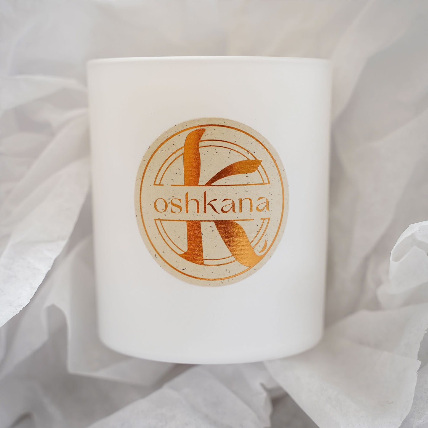 oshkana lemongrass ginger candle on white papersheet